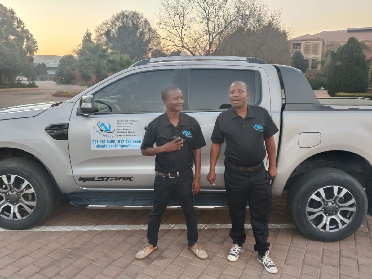 Nkgatela team with branded vehicle